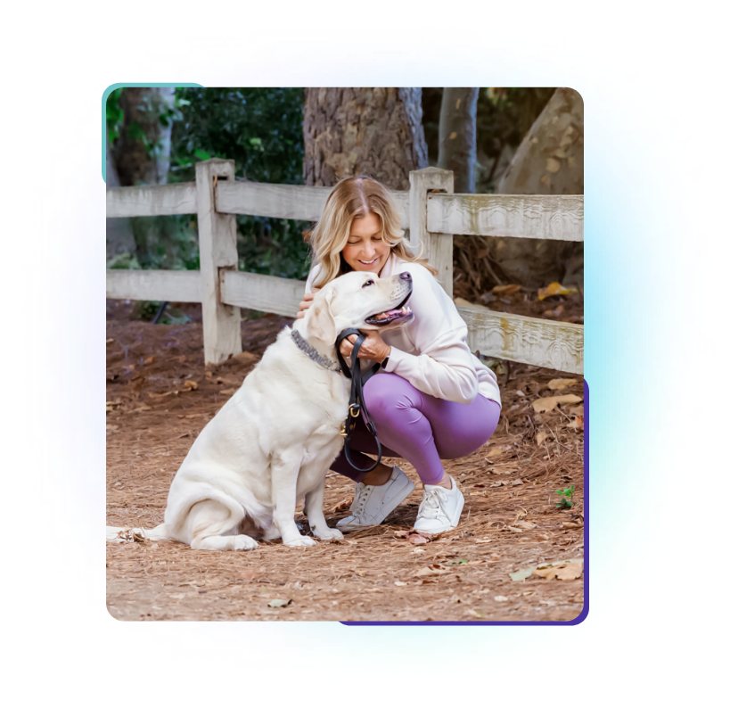 woman hugging dog